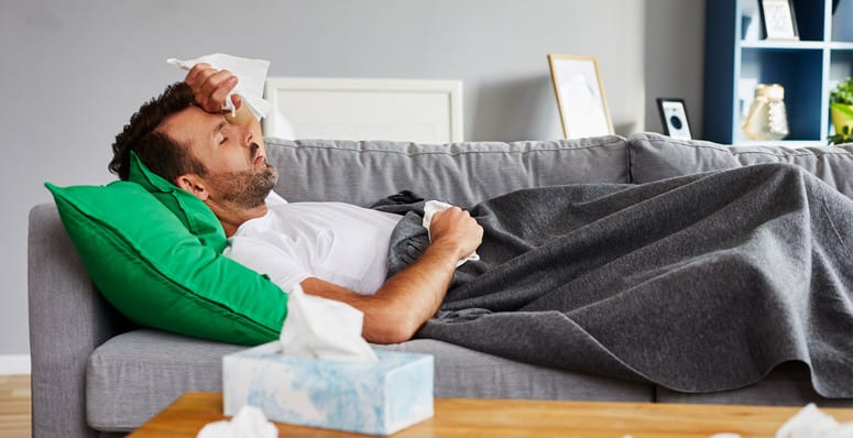 man on couch flu 600px